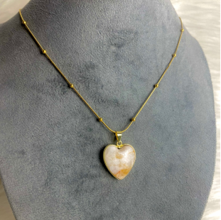 Heart shaped milky quartz stone